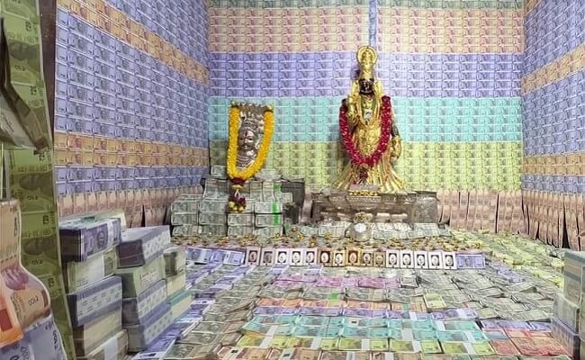 Andhra temple decorated with currency notes, gold